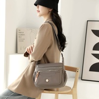 Gold Nylon Crossbody Bag with Multiple Compartments - Compact and Stylish Design thumbnail