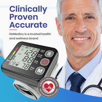 Black Compact Digital Wrist Blood Pressure Monitor with Adjustable Arm Cuff thumbnail