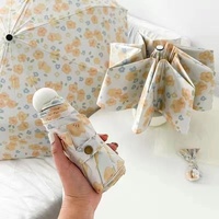 Small Yellow Flower Mini 5-Fold Umbrella - Portable, Anti-UV, Black Glue Coating thumbnail