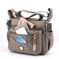 Gold Nylon Crossbody Bag with Multiple Compartments - Compact and Stylish Design thumbnail
