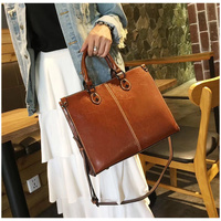 Brown Elegant Leather Handbag - Stylish Brown Tote with Adjustable Strap, Spacious and Durable thumbnail