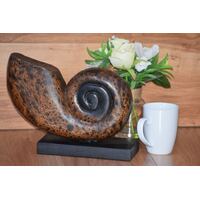 Decorative hand carved wooden shell on stand
