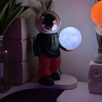 Holding the romantic moon (black top + red pants) Creative Astronaut Bluetooth Speaker with 3D Starry Sky Lighting, Portable Wireless Moon Lamp Speake